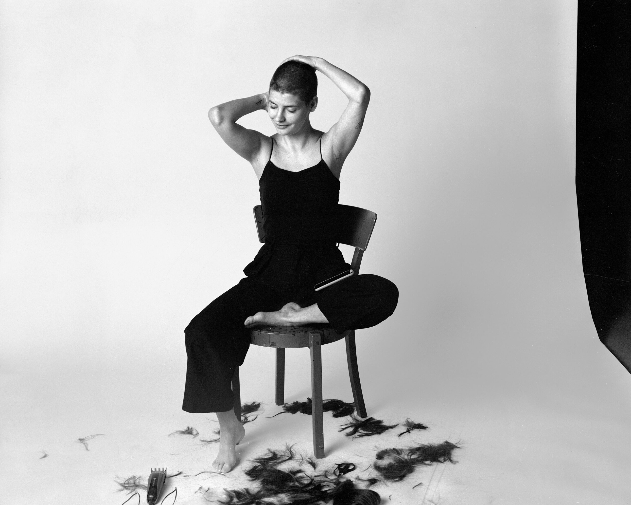 woman shaving her head